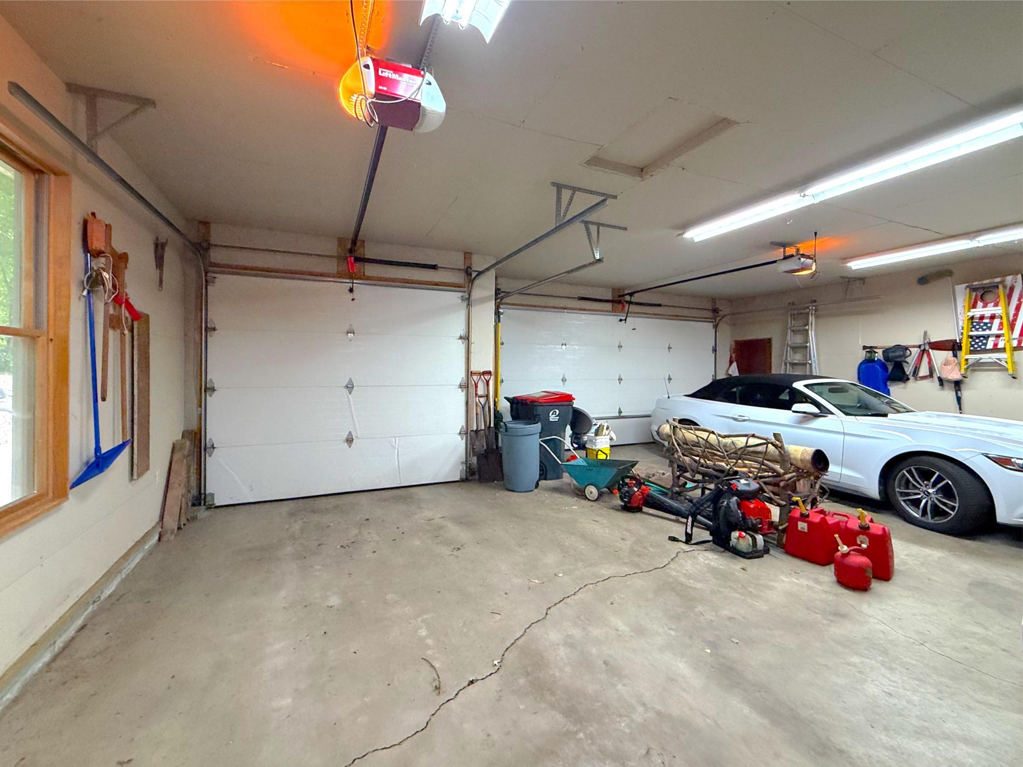 The oversized heated garage provides ample space for multiple vehicles, lake toys, and all your storage needs.