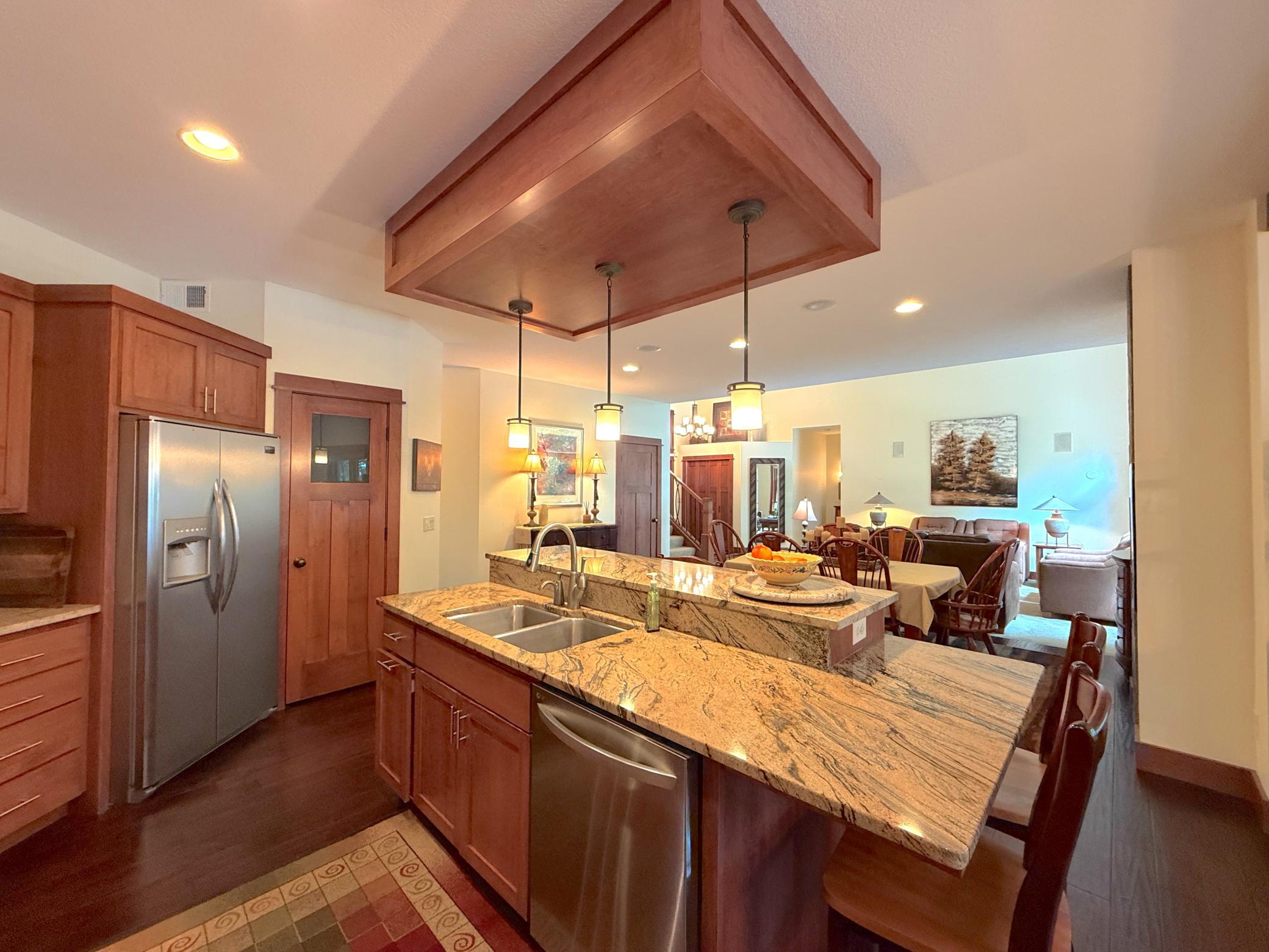 Designed for entertaining, this inviting space offers an effortless flow between the kitchen, dining, and living areas with beautiful finishes throughout.