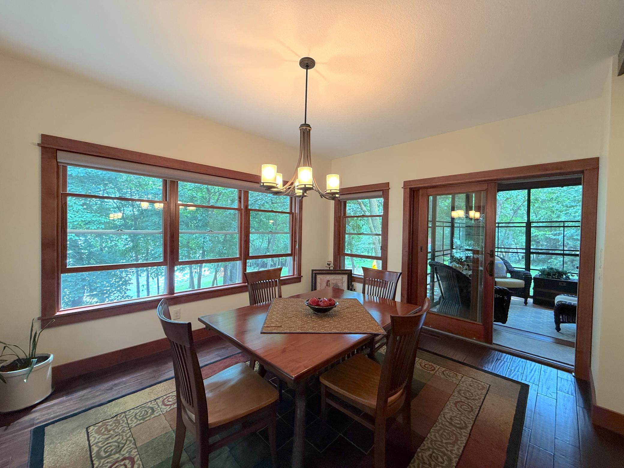 The spacious dining room combines timeless elegance with panoramic views, making it an ideal place to entertain family and friends.