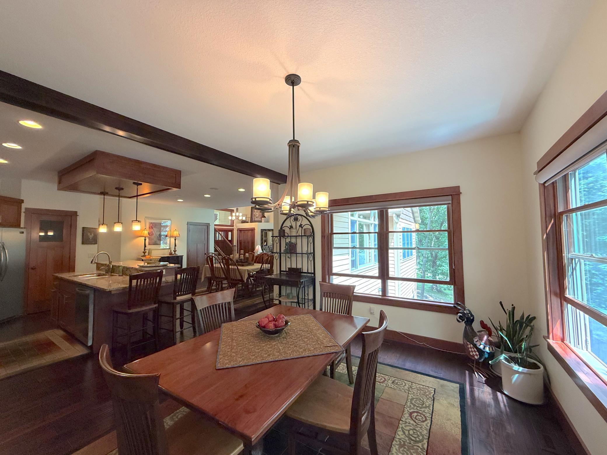 Enjoy every meal in this charming dining space, where abundant natural light and scenic surroundings create the perfect atmosphere for gathering.