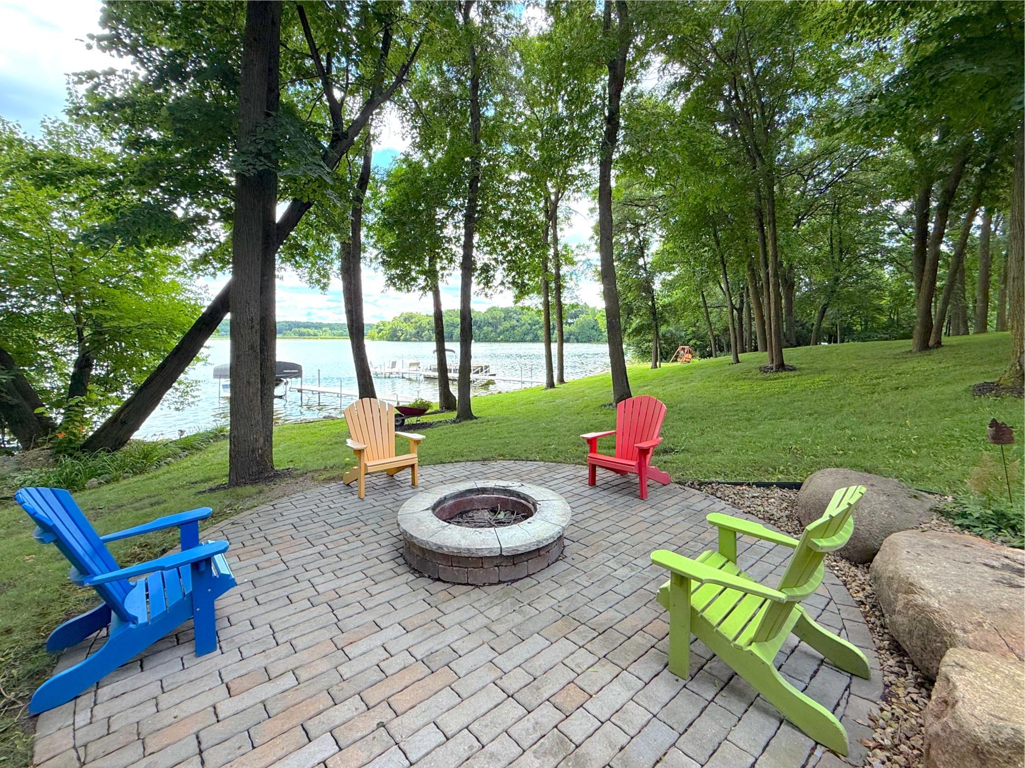 Gather around the lakeside firepit and take in the stunning backdrop of this beautifully landscaped property, designed for unforgettable evenings under the stars.