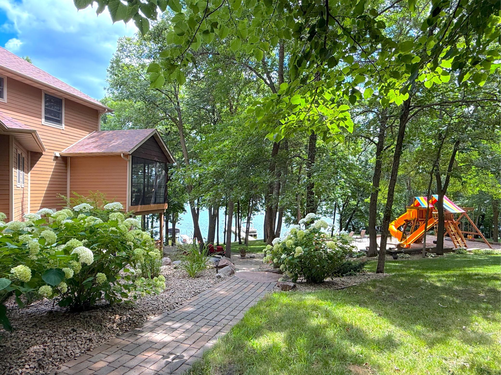 Surrounded by mature trees and natural landscaping, the property offers a private and peaceful setting to enjoy the beauty of lakeside living.