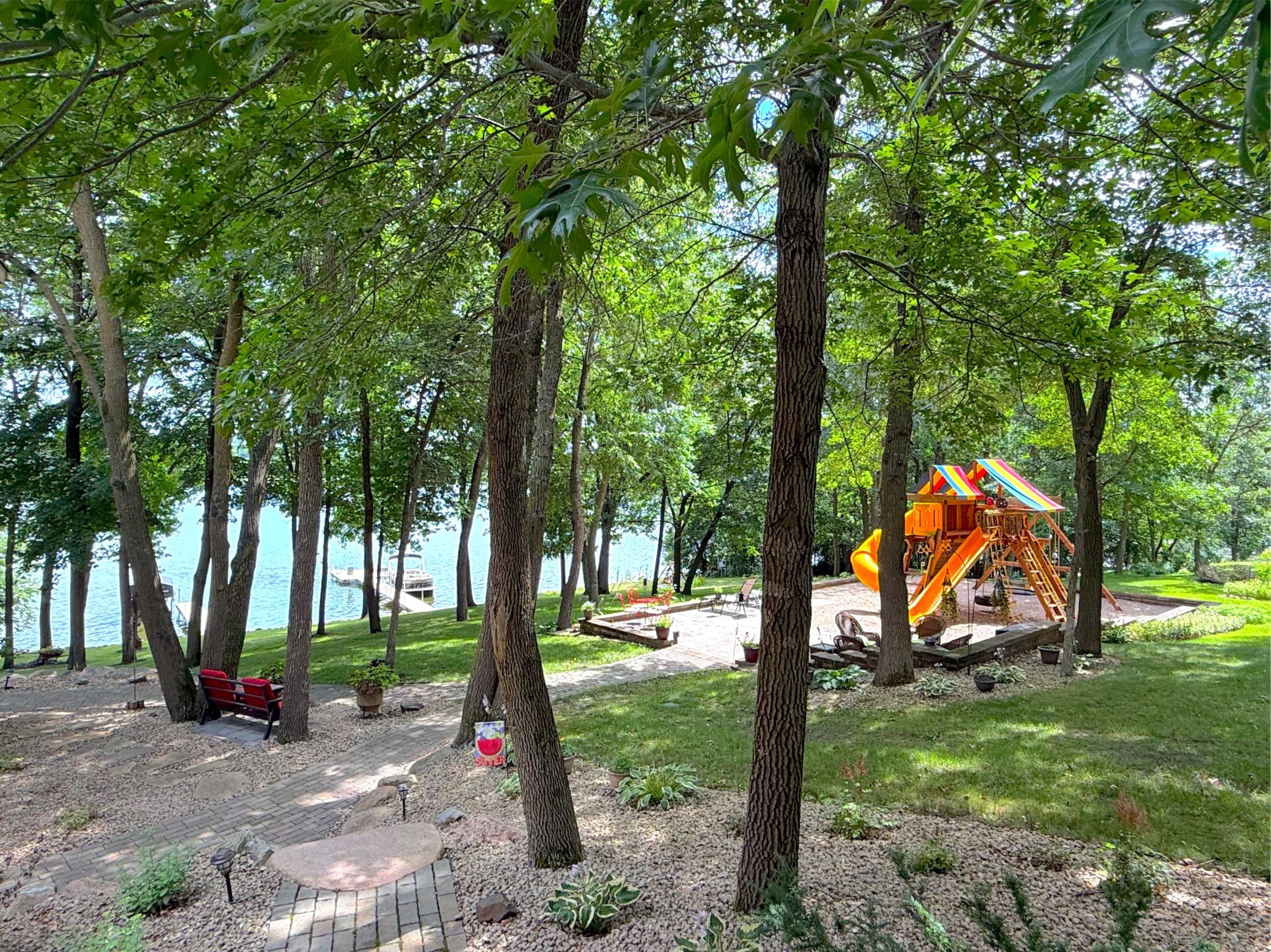 From lakeside entertaining to afternoons at the playground, this thoughtfully designed outdoor living space offers something for every member of the family.
