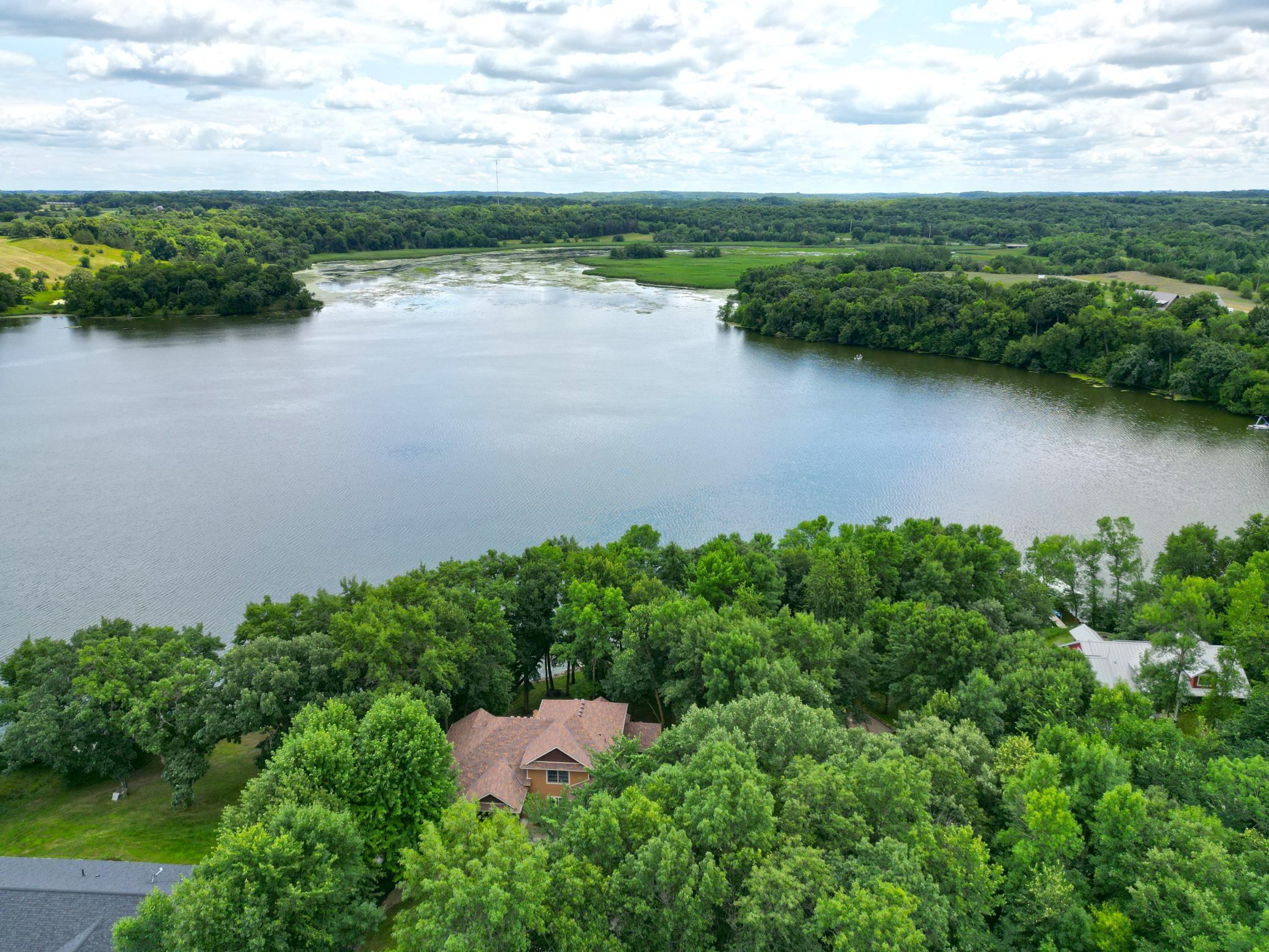 Surrounded by mature trees, this home combines a wonderfully private setting with sweeping Lake Louisa views, creating the perfect backdrop for lakeside living.