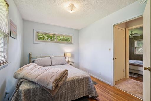 Another angle of the bedroom showing closet space and access to the hallway.