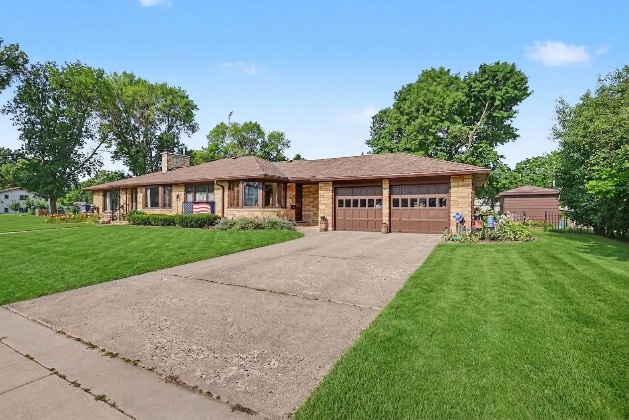 Concrete driveway and attached 21x24 garage, Montgomery MN home for sale.