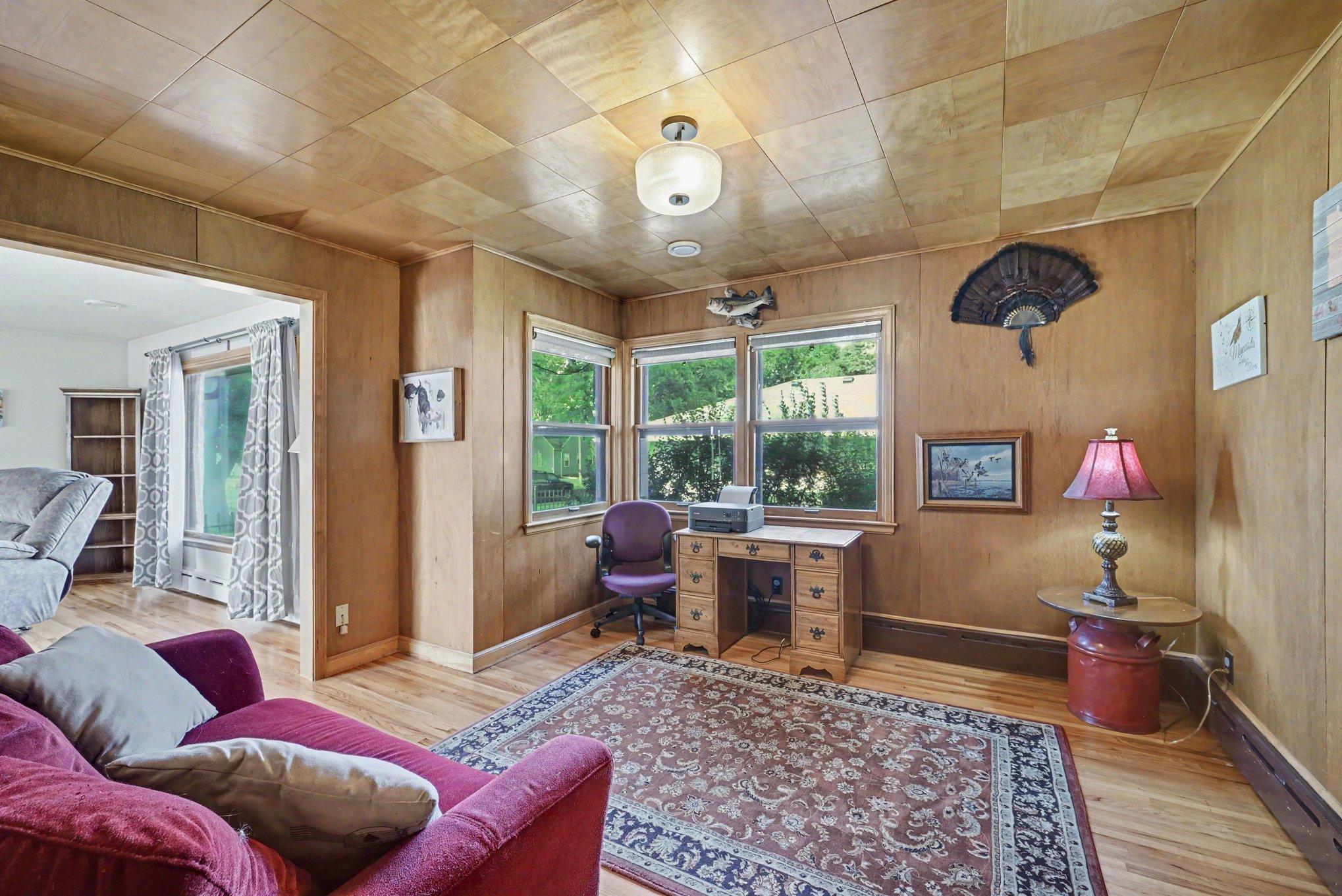 Wood paneled main floor office with original 1950s ceiling detail, Montgomery, MN.