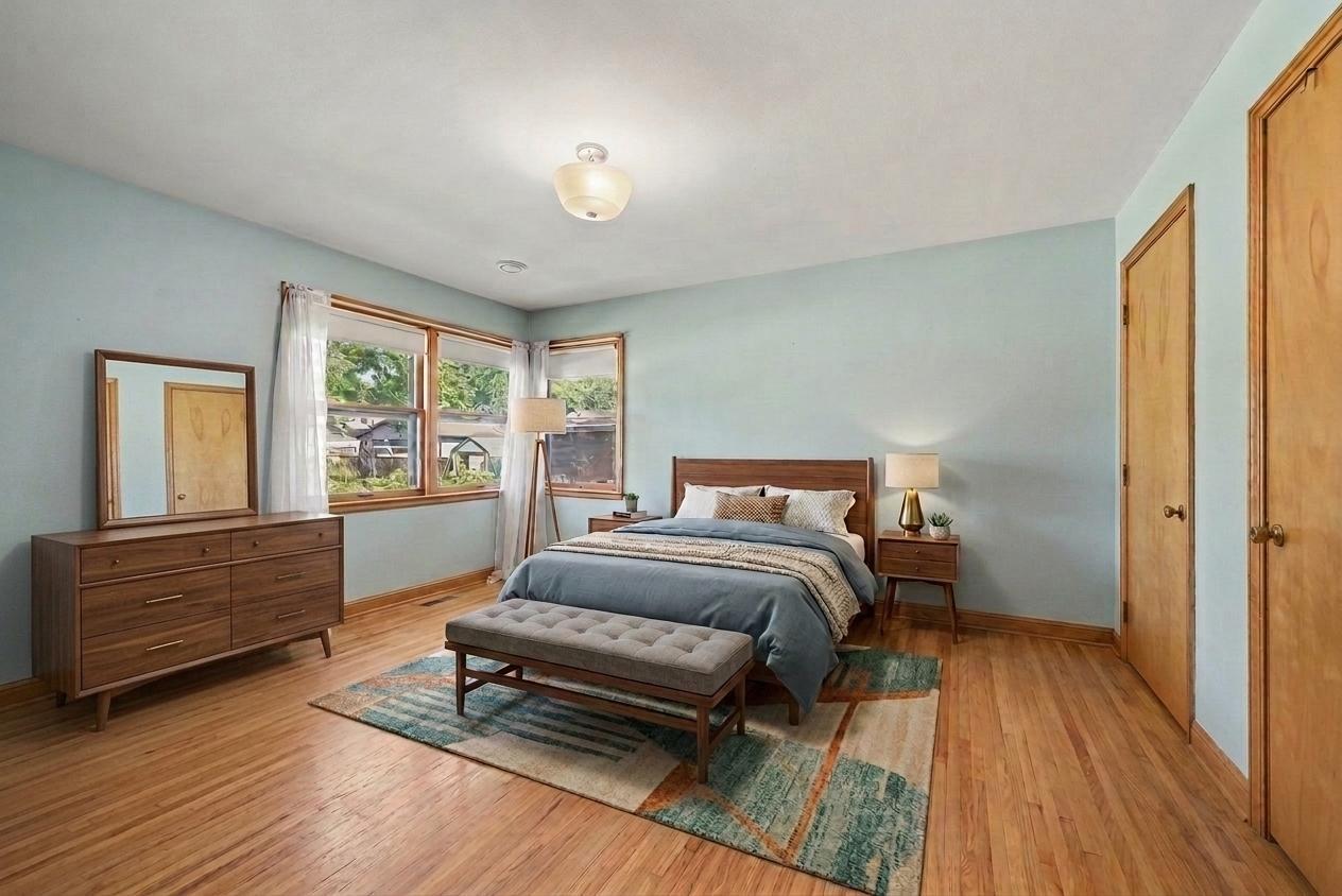 Main floor primary bedroom shown with virtual staging, Montgomery MN rambler.