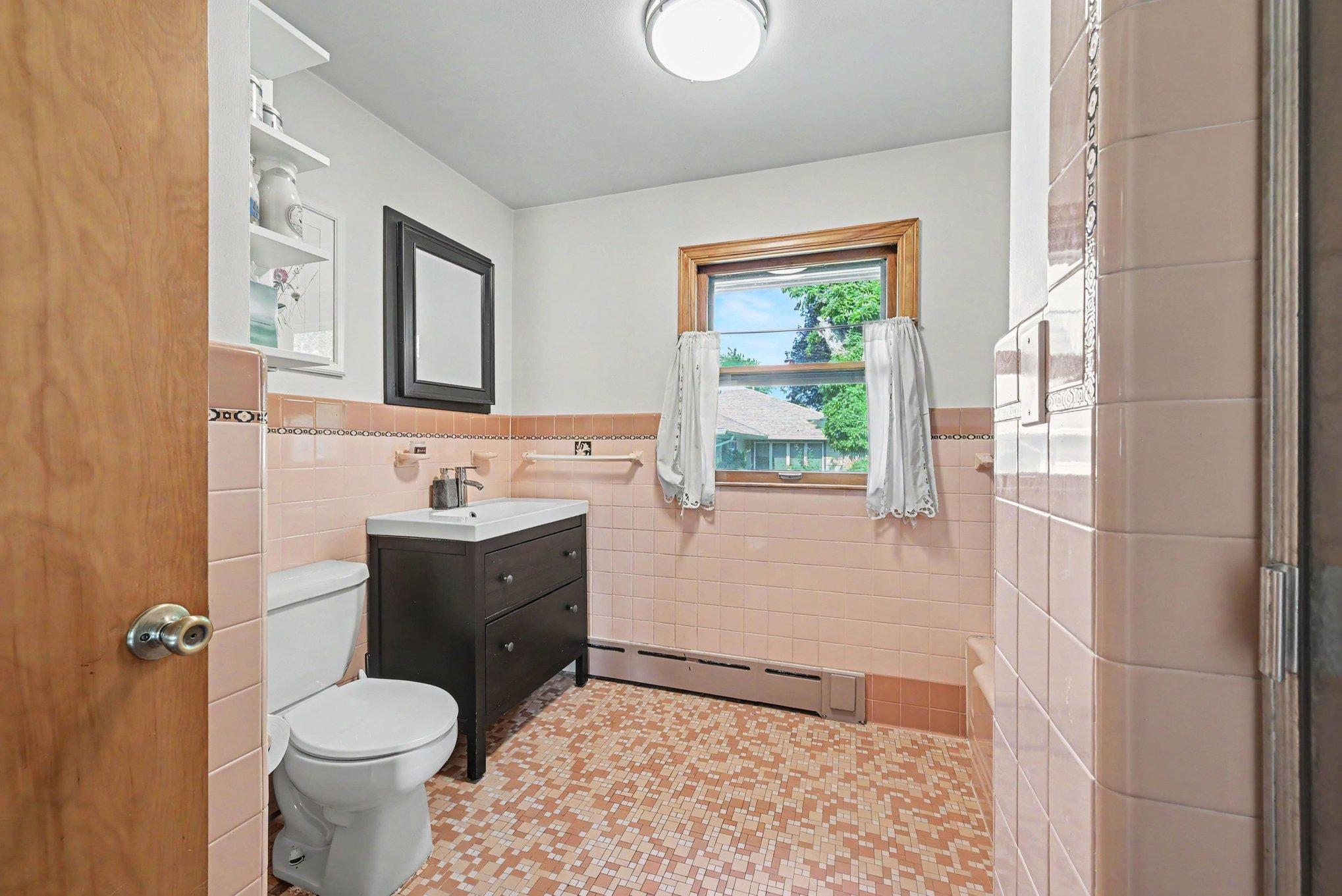 Main floor full bath with separate tub and walk in shower, 300 5th Street NE Montgomery MN.