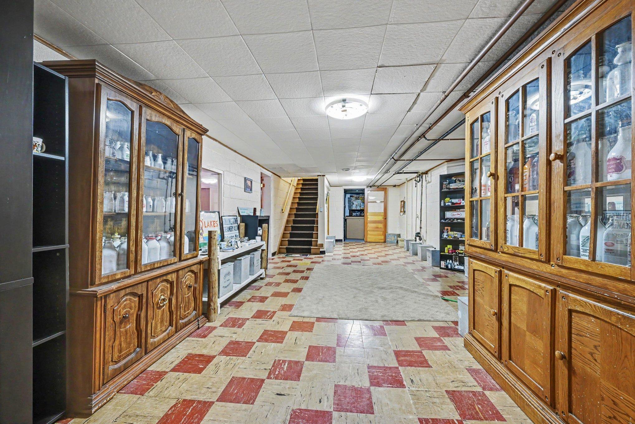 Built in glass front cabinetry in the lower level flex space, 1950 home Montgomery MN.