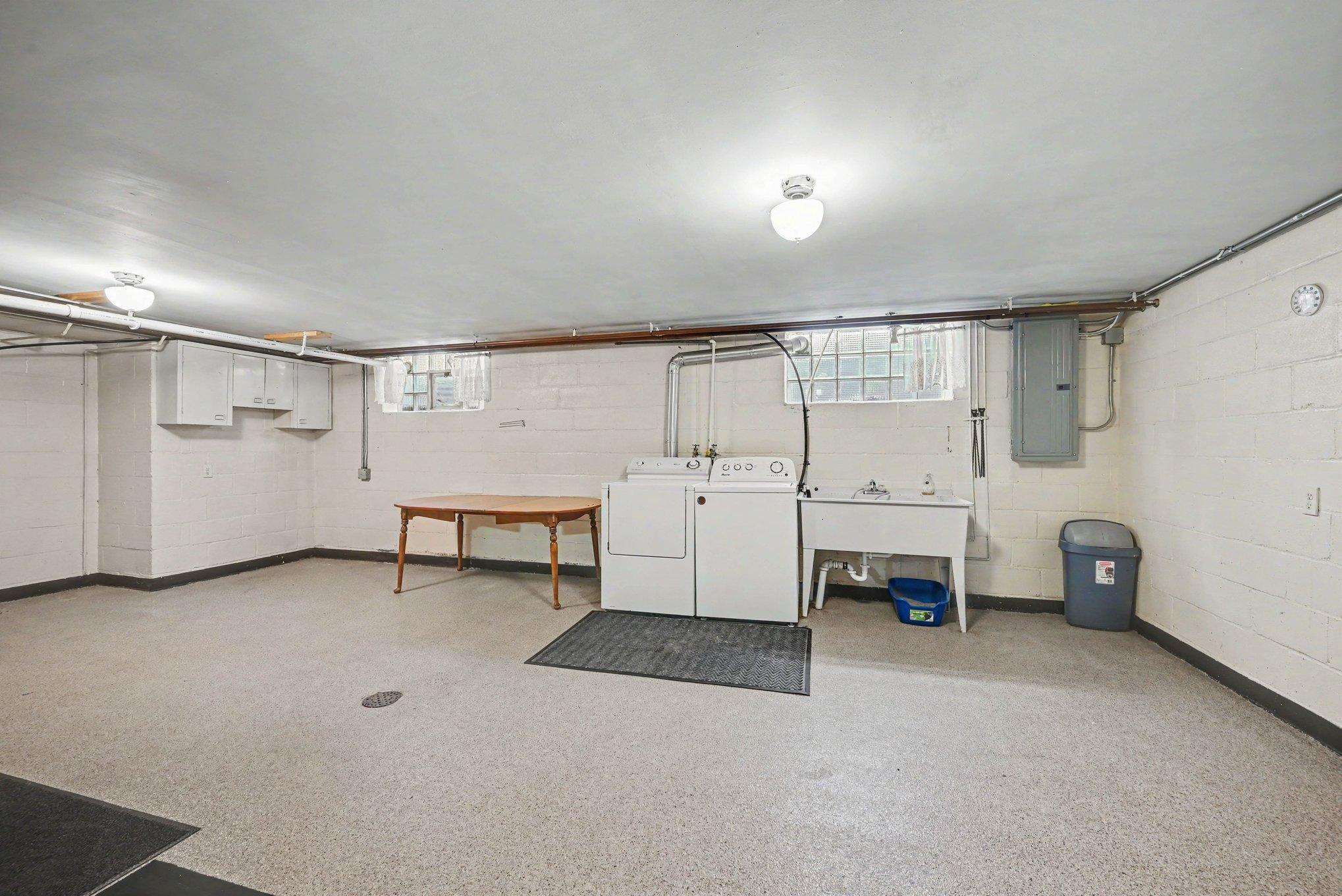 23x14 lower level laundry room with utility sink, Montgomery MN home.