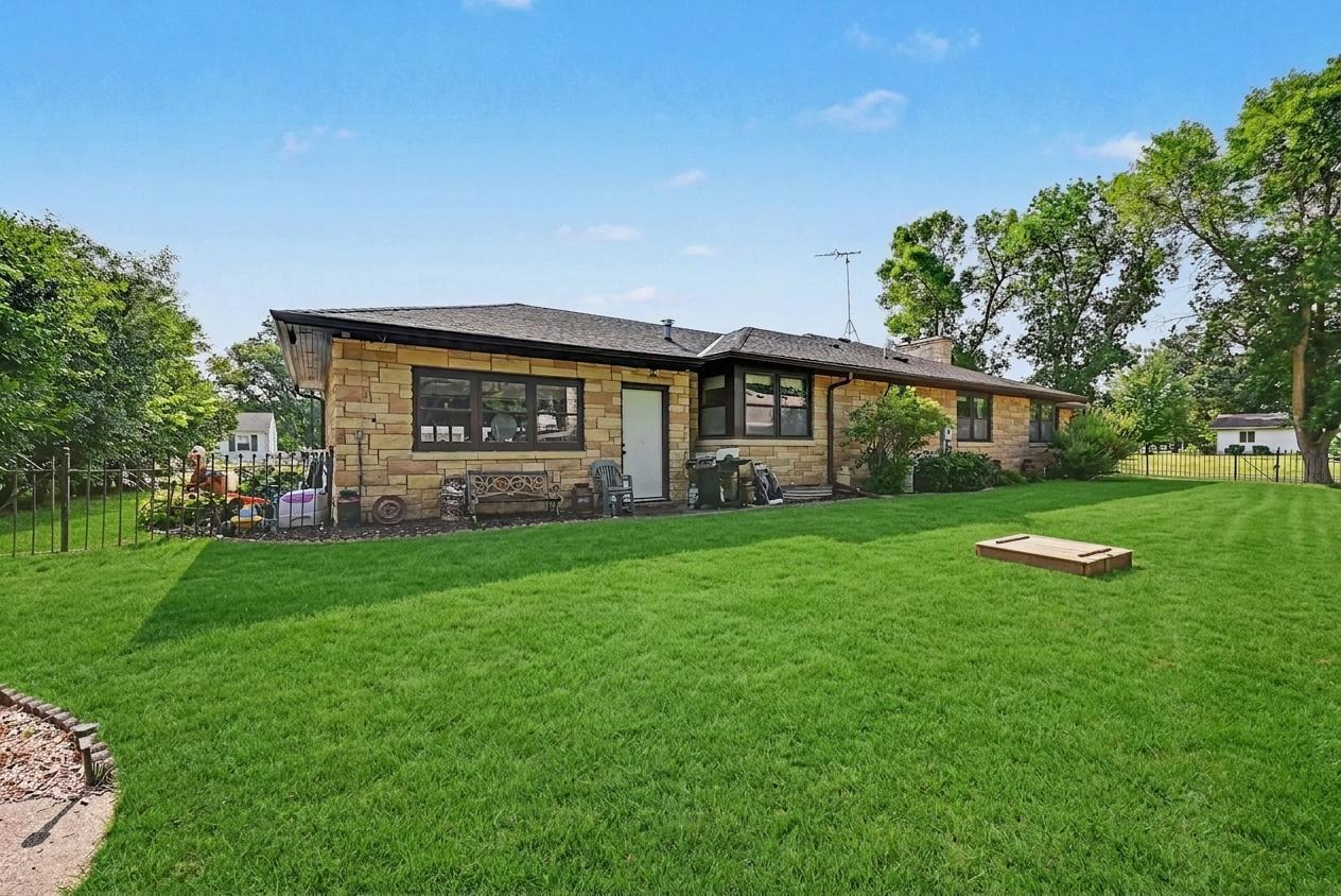 Level backyard and storage shed with alley access, Montgomery MN home for sale.