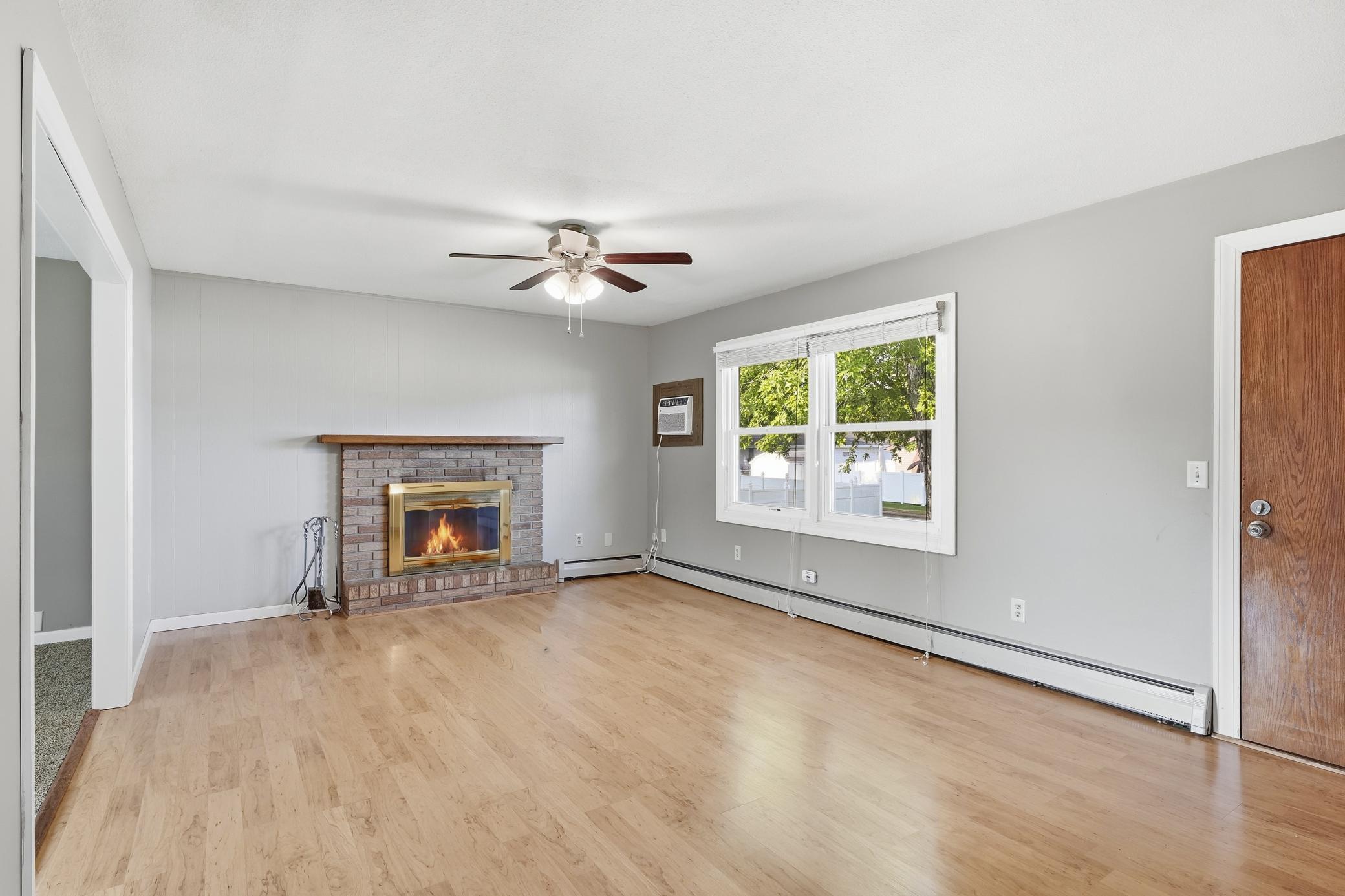 Main level living room with fireplace