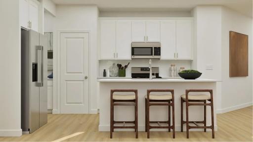 (Rendering, actual home's finishes will vary.) The kitchen is perfect for home cooks of all skill levels. It comes fully equipped with new stainless steel appliances, designer-selected cabinetry and a versatile center island.