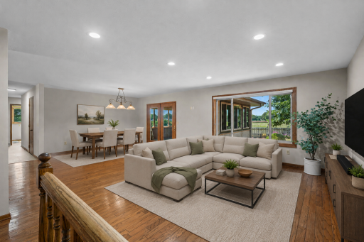Large living and dining area. Beautiful hardwood flooring and large windows. (Virtually staged to highlight this great space!)