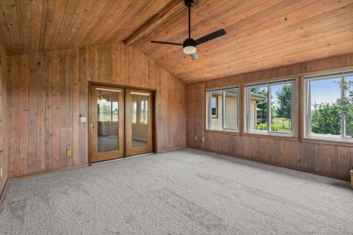 Three season porch retreat! Vaulted ceiling, large windows! (Virtual staging has been used to help highlight this home's features)