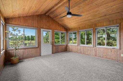 Three season porch retreat! Vaulted ceiling, large windows! Brand new carpeting!