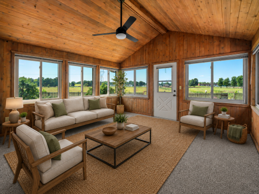 Three season porch retreat! Vaulted ceiling, large windows! (Virtual staging has been used to help highlight this home's features)
