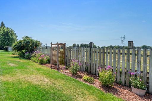 Privacy fence with beautiful landscaping.