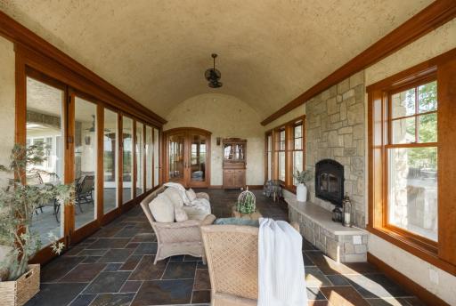You can access the summer kitchen and patio as well as the screened in porch from this room.