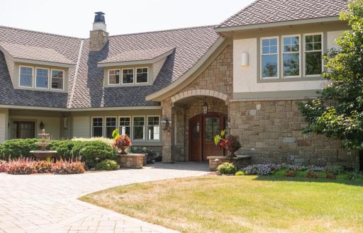 Formal front entrance as well as a side entrance by the garage.