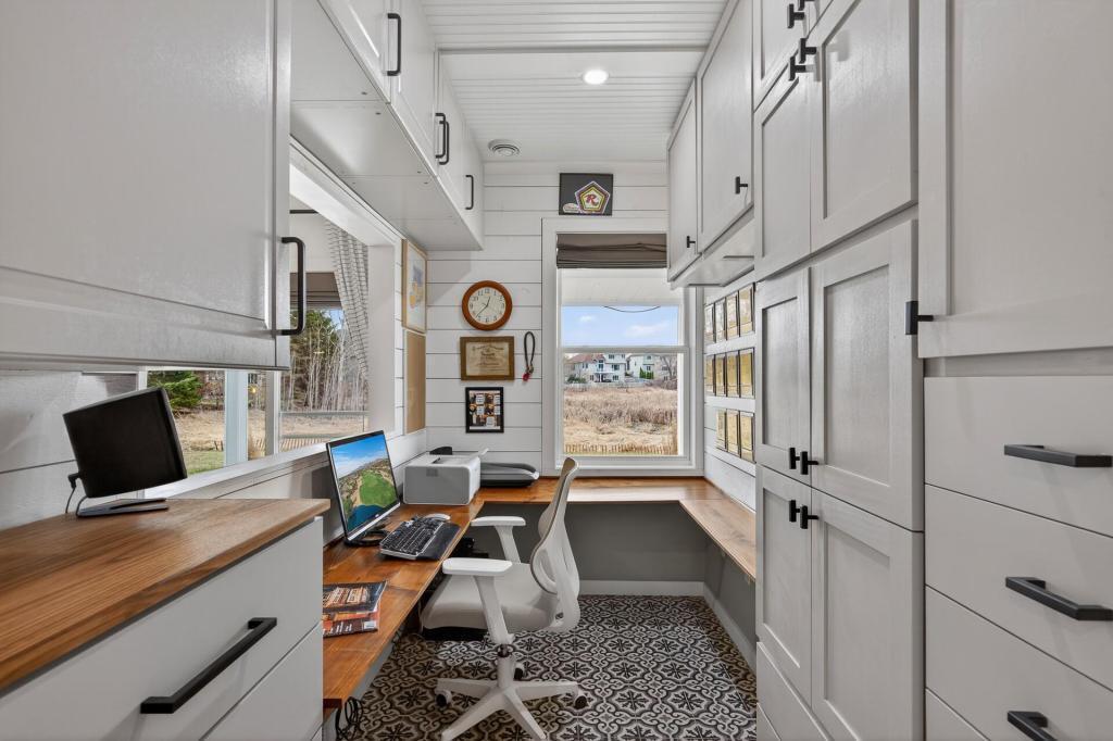 Office with nice views of the pond and the TV in the family room.