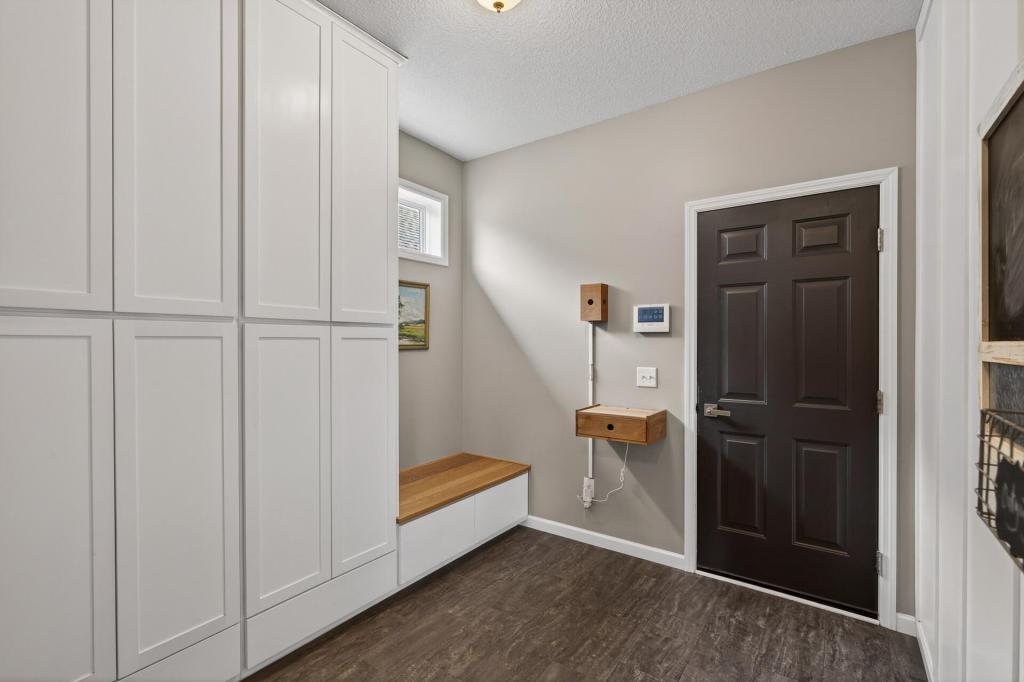 Custom-build mudroom storage bench and cabinets.