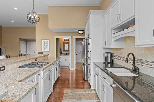 A ton of custom cabinetry with upgraded pull our drawers and storage spaces. No details missed in this design. Stainless Steel appliances, gas stove top, Granite countertop and beautifully designed.