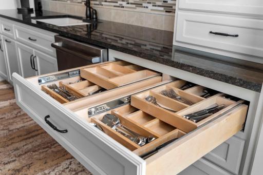 Custom cabinetry with pull out drawers with built-in storage and organization.