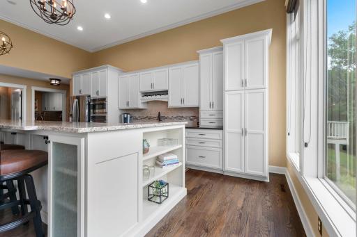 Elegant cabinet storage and shelving. Thoughtfully designed with cabinets on both sides of the island.