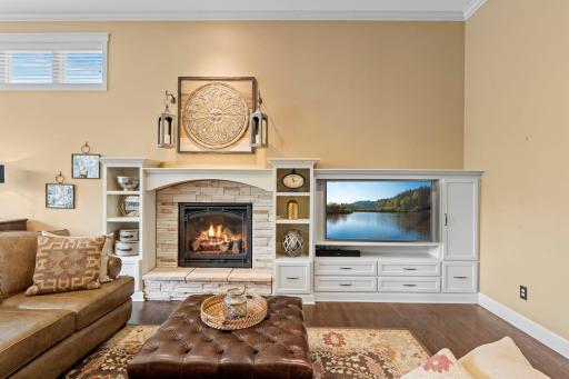 Custom built-ins and cozy gas fireplace highlight be beautiful, modern stone!