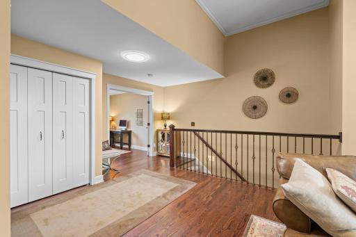 Welcome your guests with white Cratsman style doors, beautiful hardwood flooring, open staircase, high ceilings, main level office with French Doors!