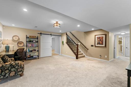 Great spaces including a stylish barn door to exercise or flex room.