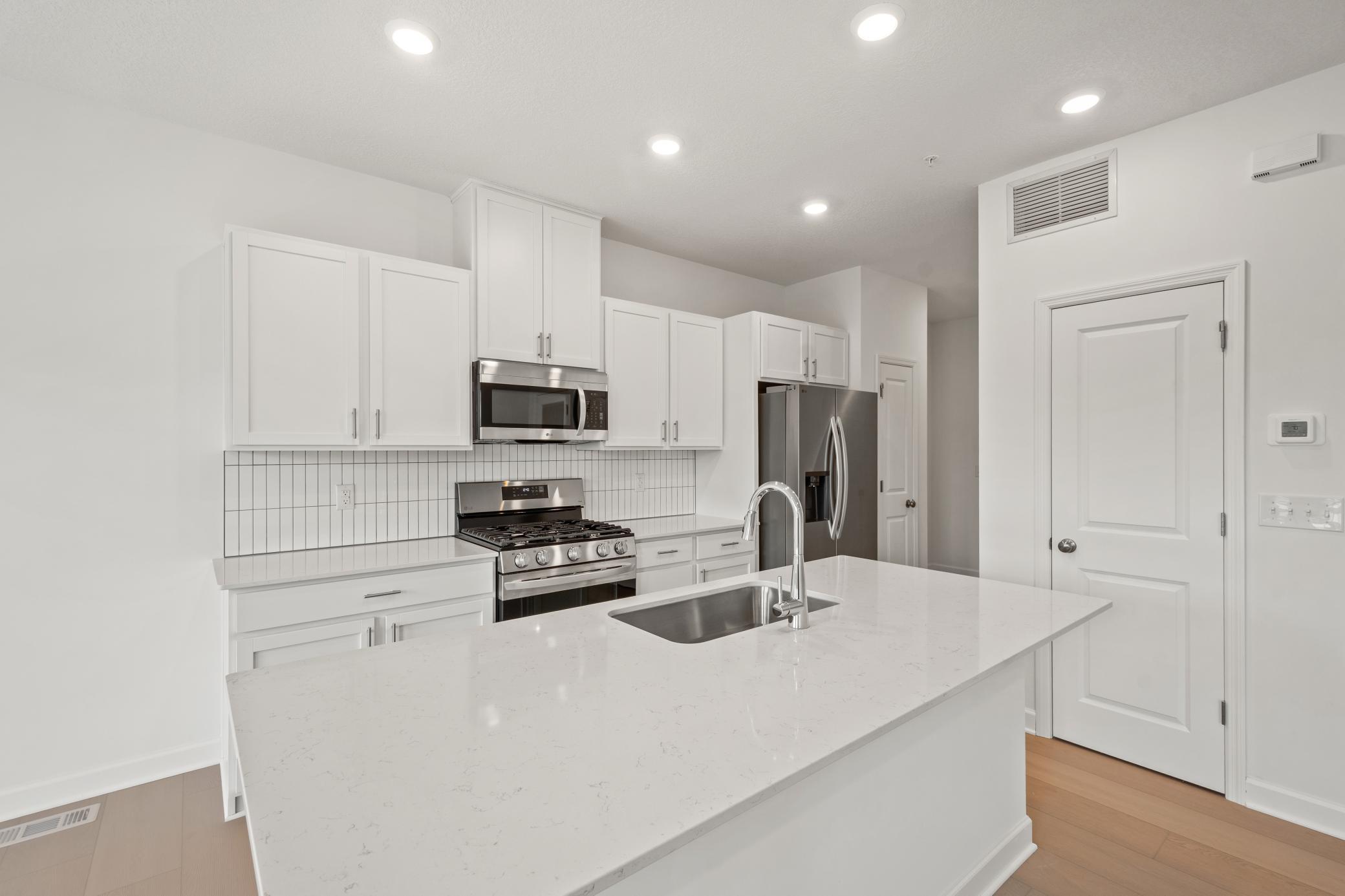 (Photo of an inventory home, actual homes finishes will vary) Imagine cooking a meal in this stunning kitchen.