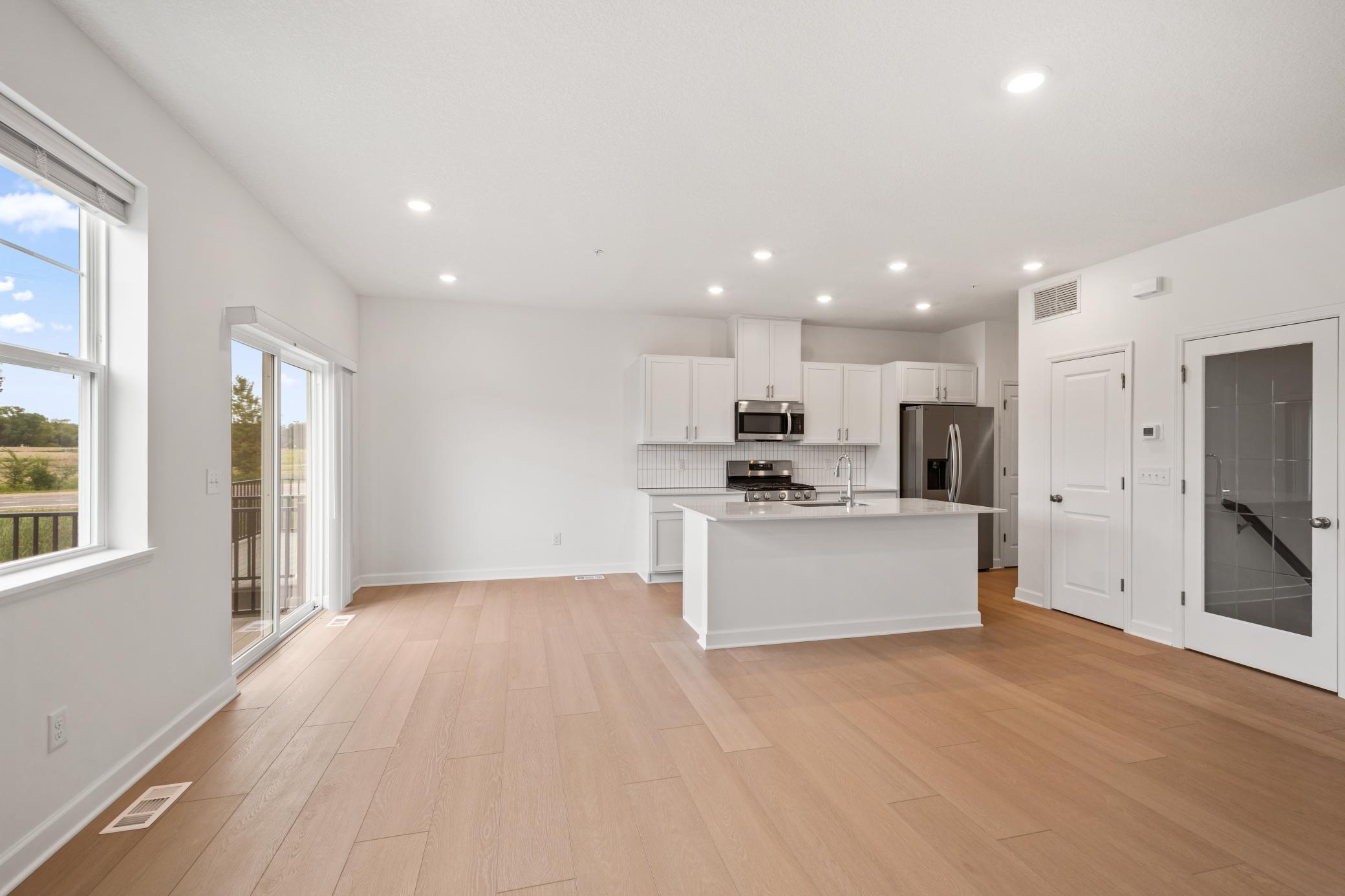 (Photo of an inventory home, actual homes finishes will vary) Soaked in natural sunlight, the homes eat-in dining room has ample space for a dining table located in the heart of the home.