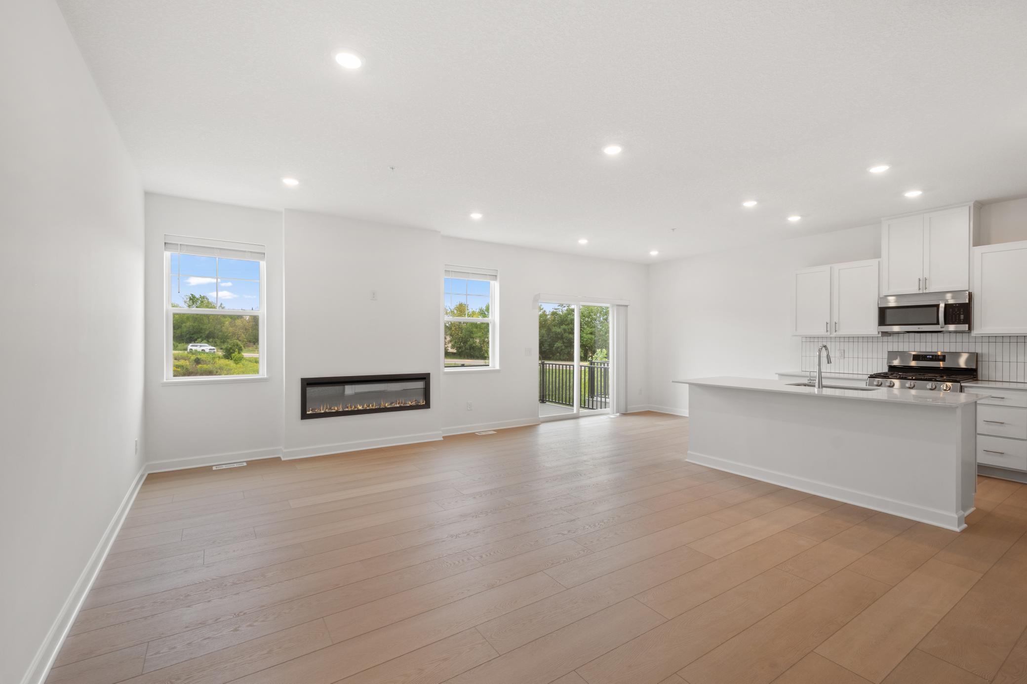(Photo of an inventory home, actual homes finishes will vary) The Great Room is cozy with an electric fireplace.