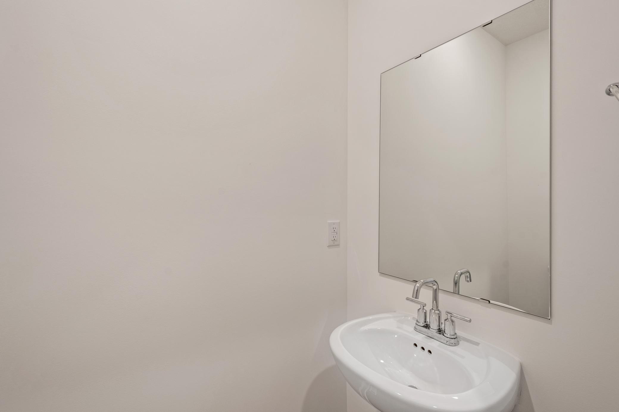 (Photo of an inventory home, actual homes finishes will vary) Powder bath.