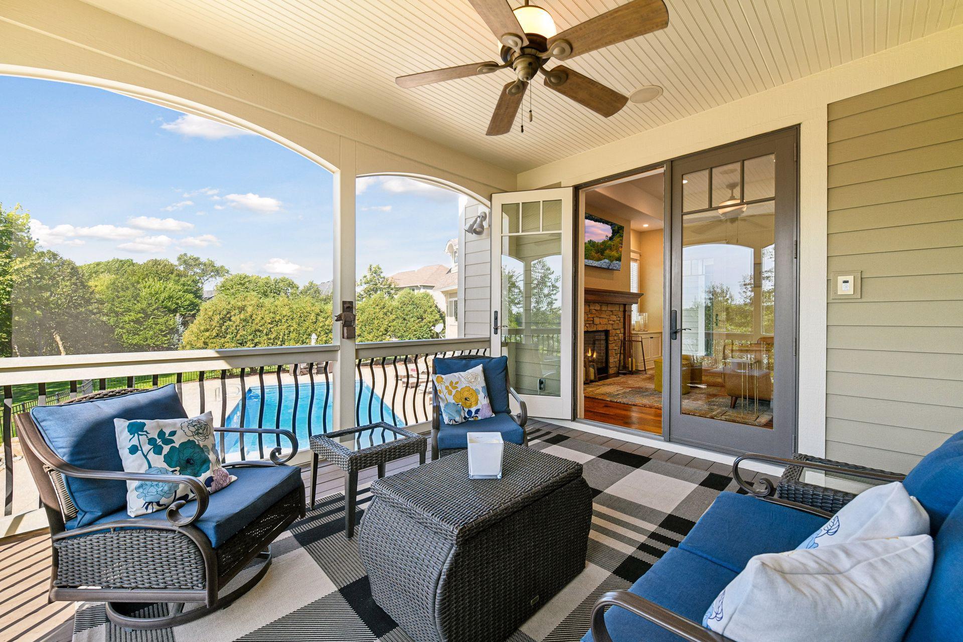 Screened in porch looking over the pool and the lake.