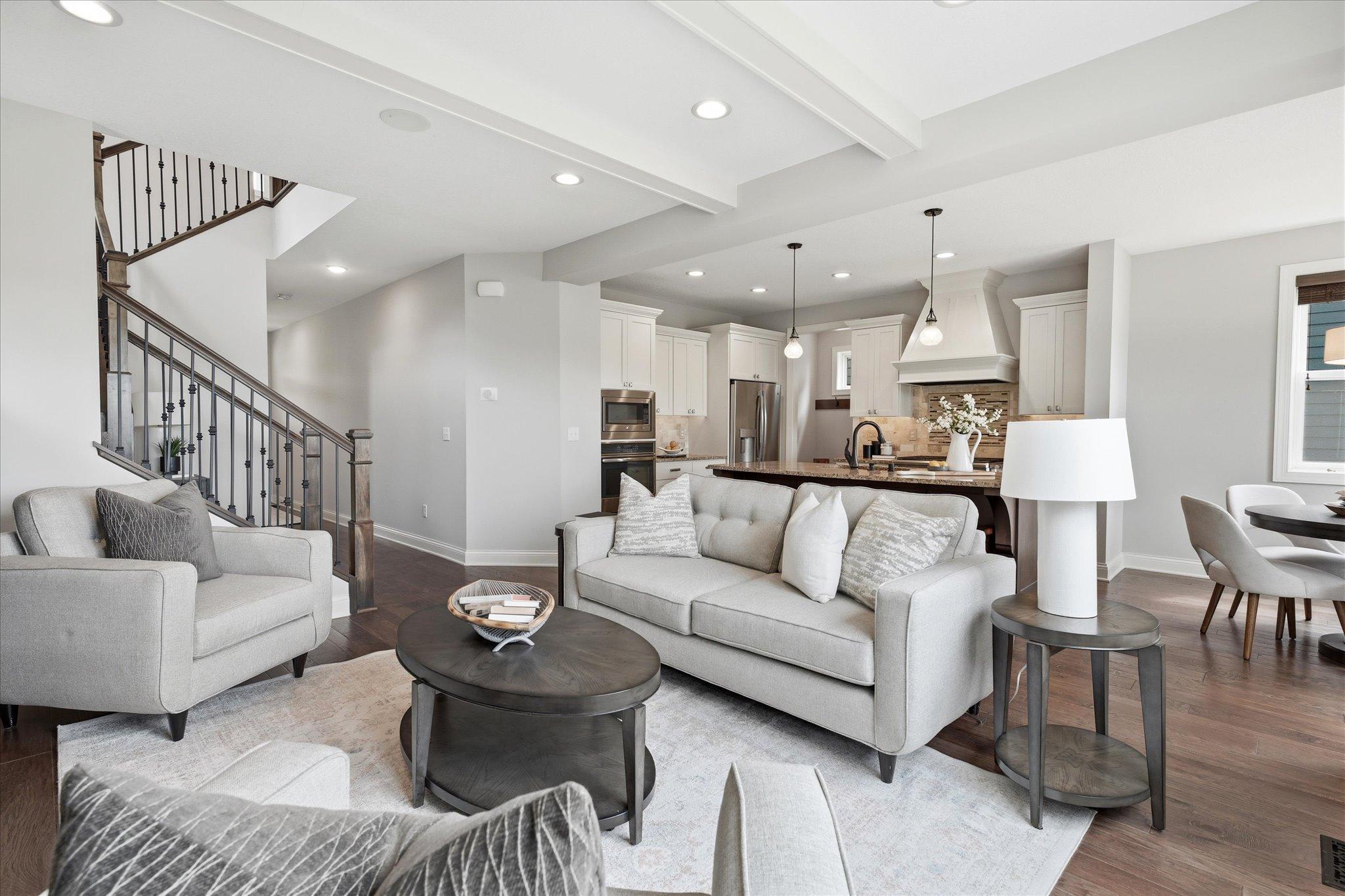 Thoughtfully designed open floor plan flows effortlessly from the great room into the kitchen and dining area, making everyday living and entertaining a breeze.