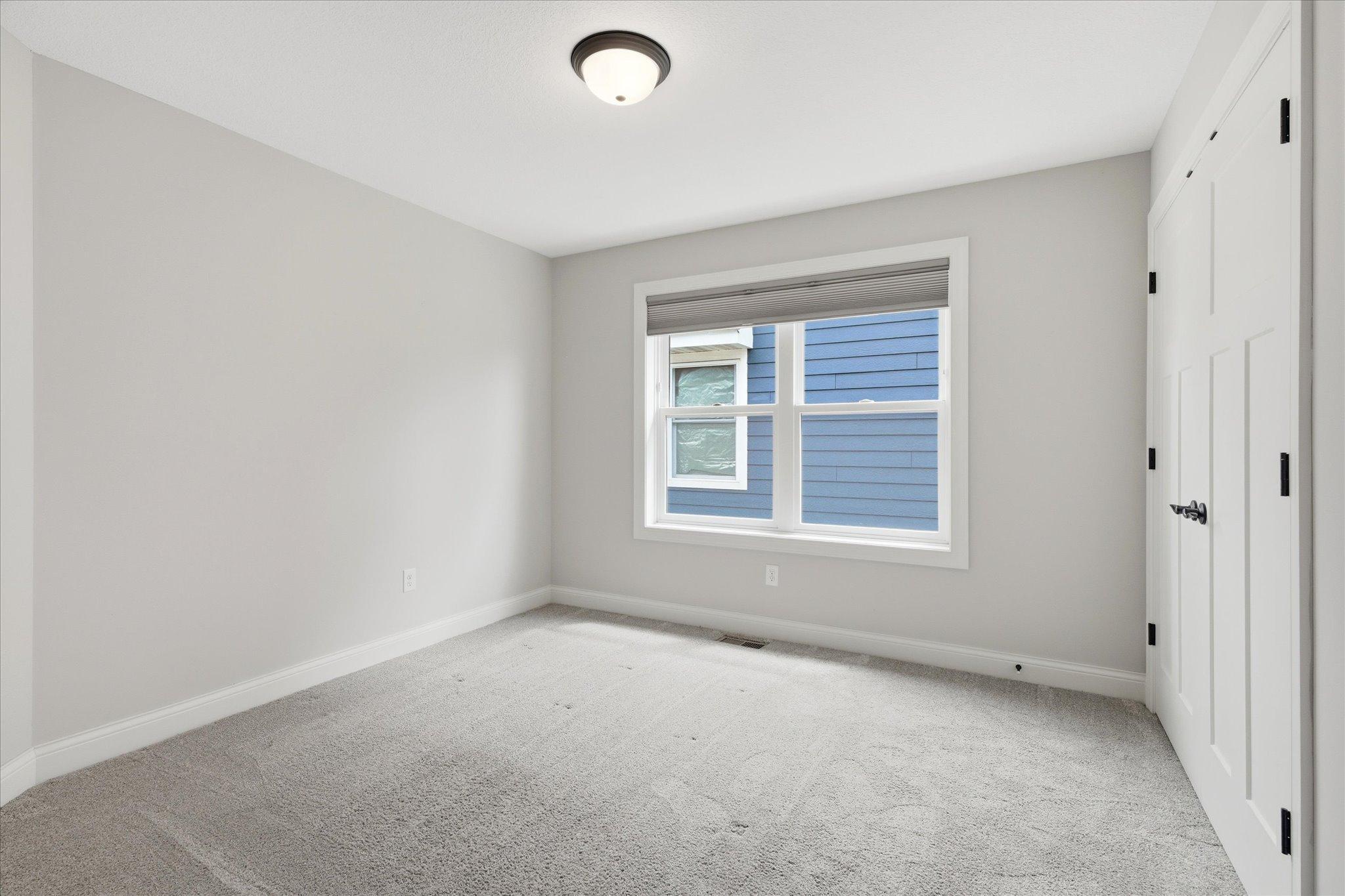 Bedroom #3 provides flexible space, complete with a large closet and abundant natural light.