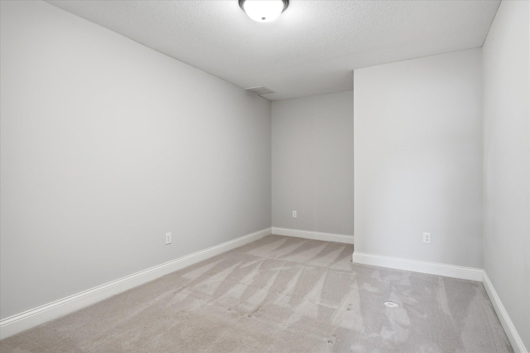 Comfortable lower-level flex room offers generous space, and a quiet retreat.