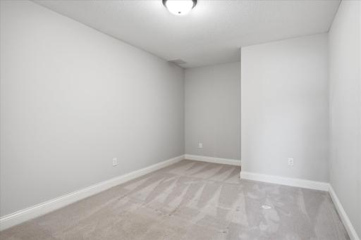 Comfortable lower-level flex room offers generous space, and a quiet retreat.