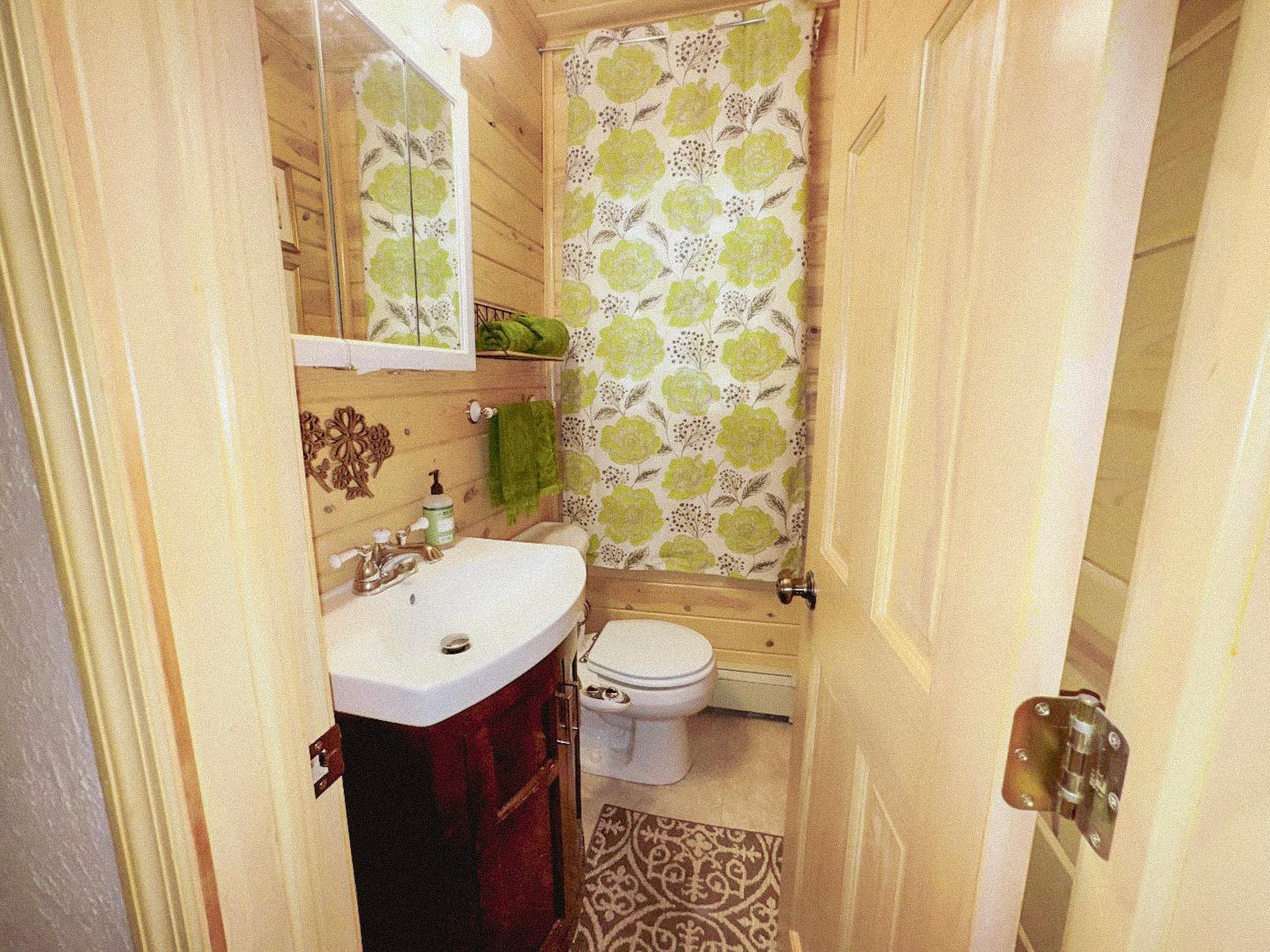 Generous primary bedroom with a private half bath.