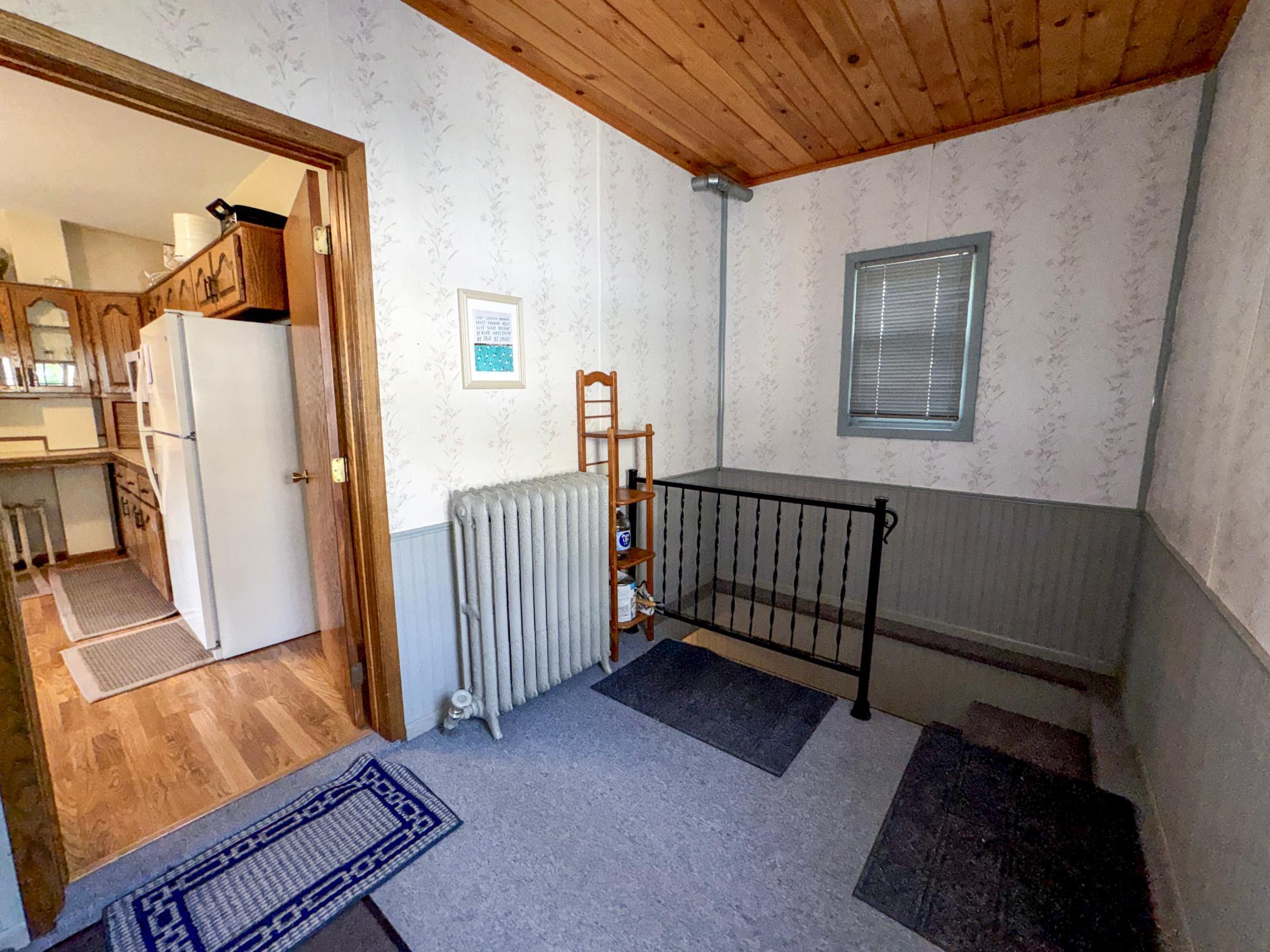 Welcoming back entrance with access to the home's thoughtfully designed multi-level layout.