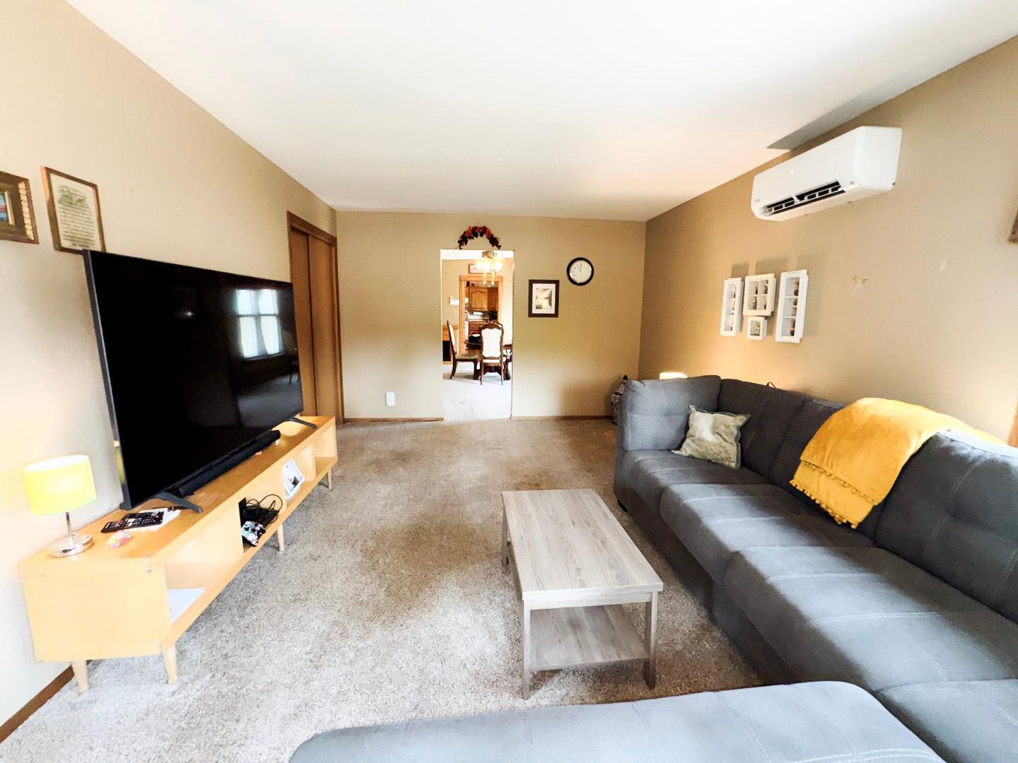 Bright and spacious main-level living room with plenty of room for gathering.