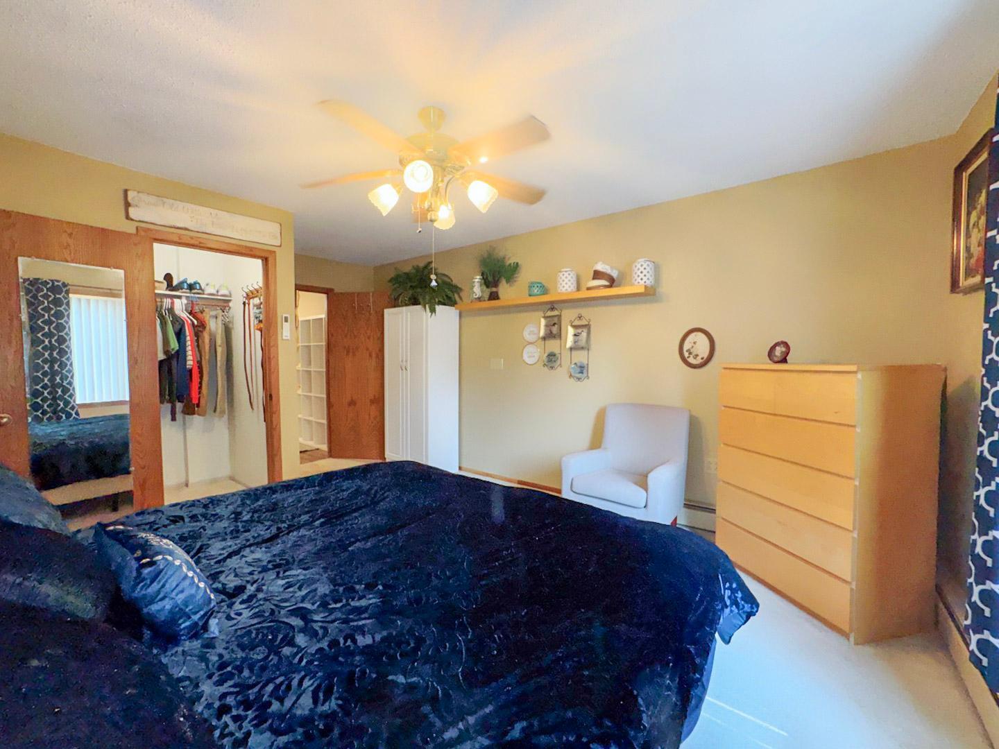Primary Main Floor Bedroom with a walk in closet and 1/2 bath just off of this.