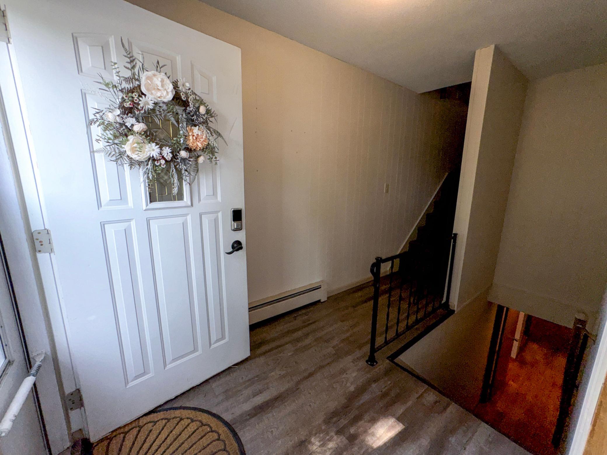 Welcoming front entrance with access to the home's thoughtfully designed multi-level layout.