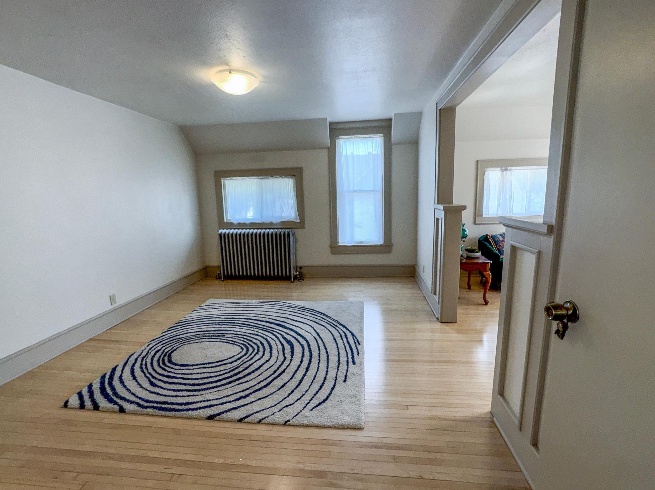 Charming upper level filled with character. Living room or dining room
