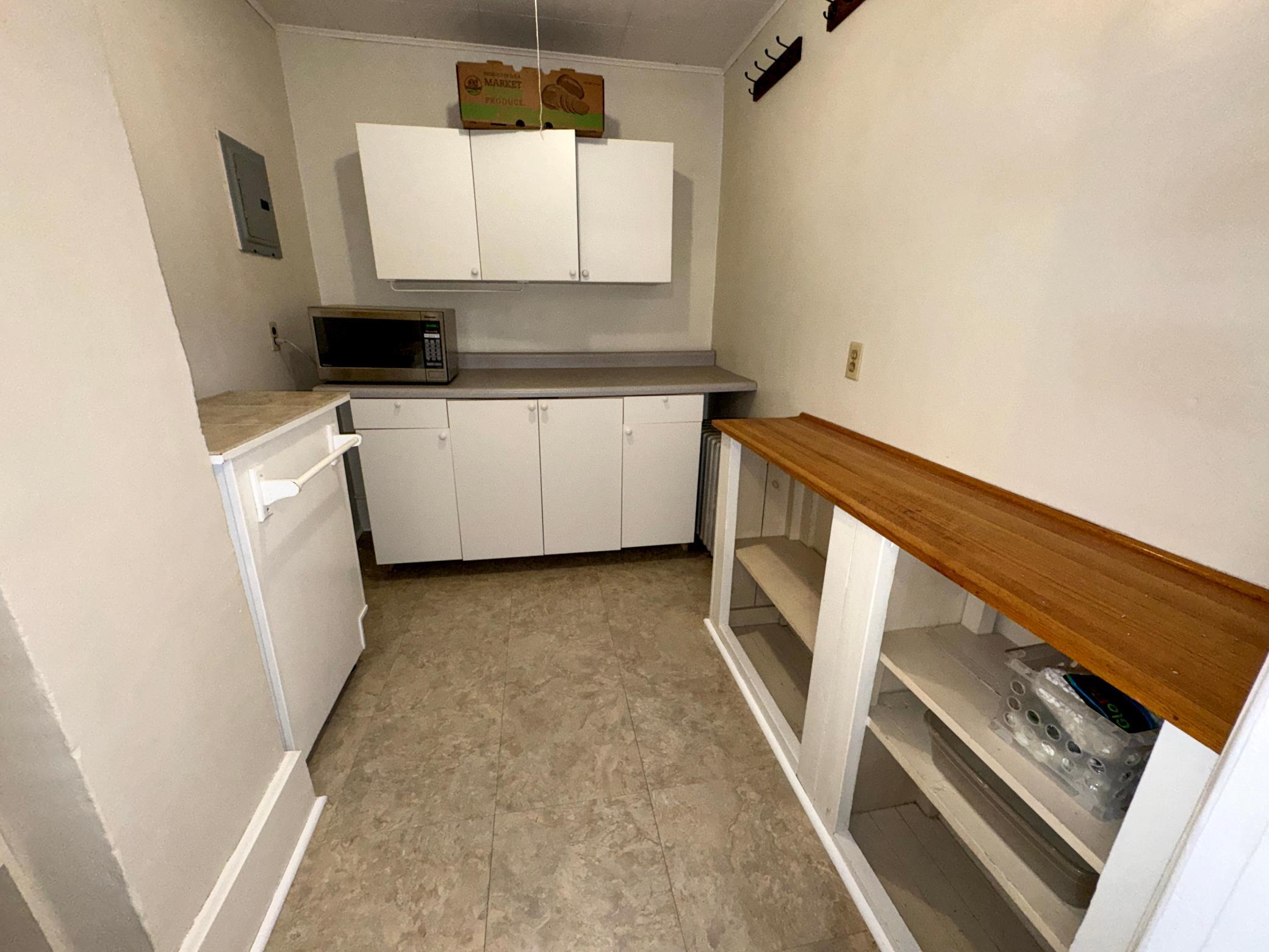 Upper Level large walk in pantry just off of the kitchen with additional cabinetry and storage