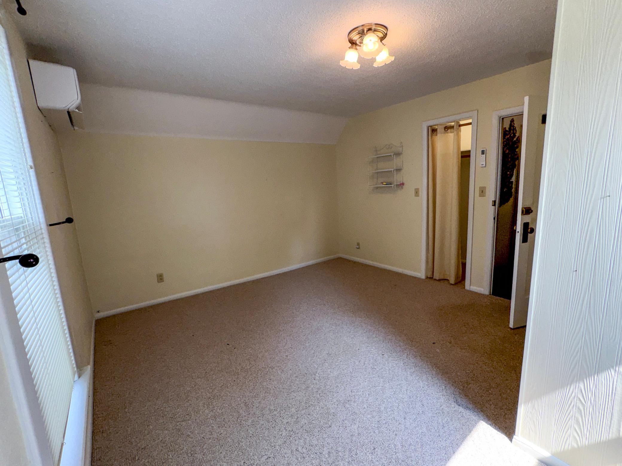 Spacious upstairs bedroom with private full bathroom.